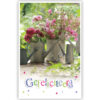 Roze bloemen in tinnen gieters Roze bloemen in tinnen gieters